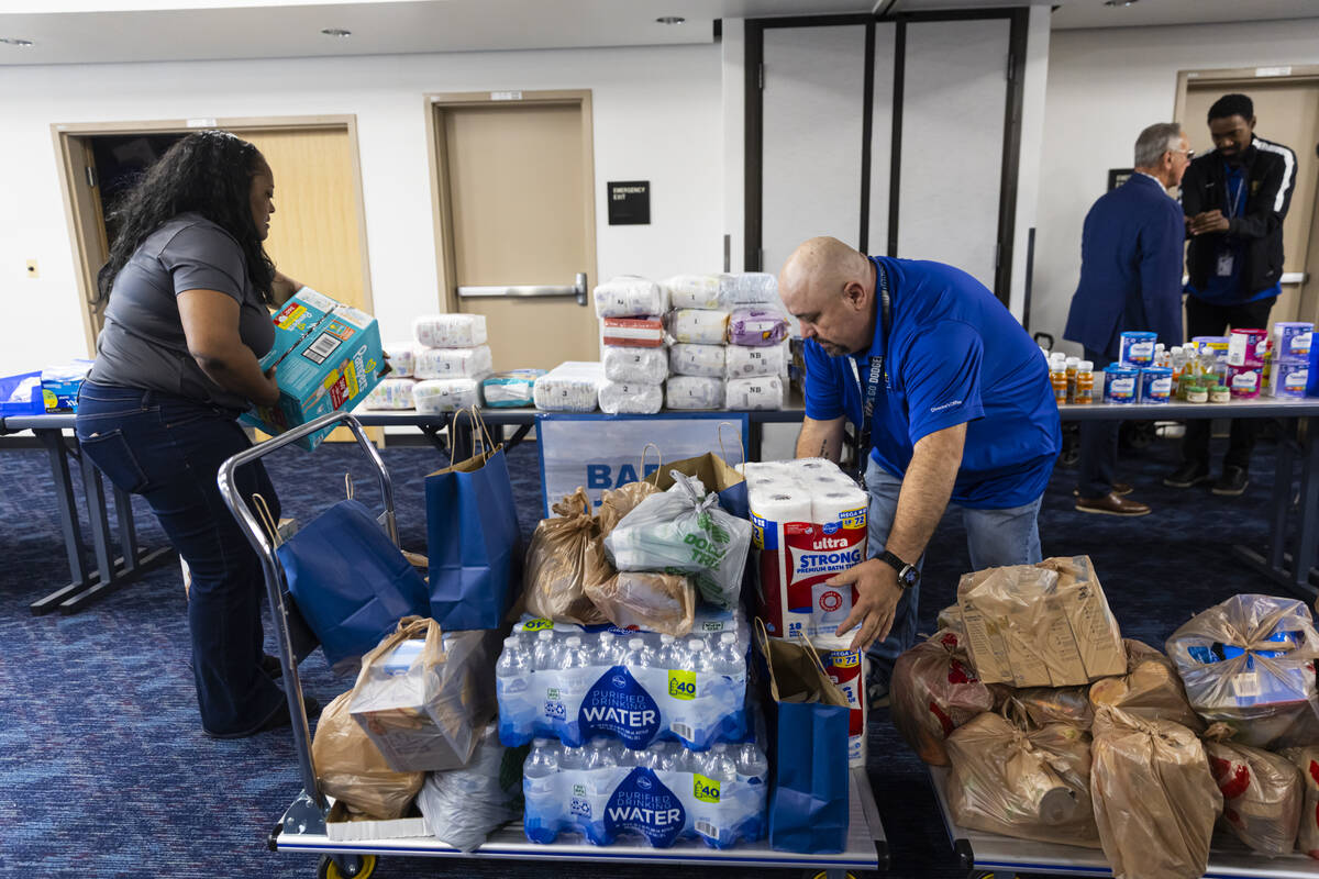 LaTonya Byrd, left, and Oscar Hernandez, both with the Clark County Department of Aviation, org ...