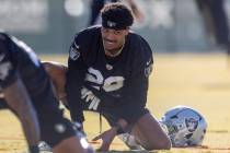 Raiders cornerback Darien Porter (26) stretches during the team’s practice at the Intermounta ...