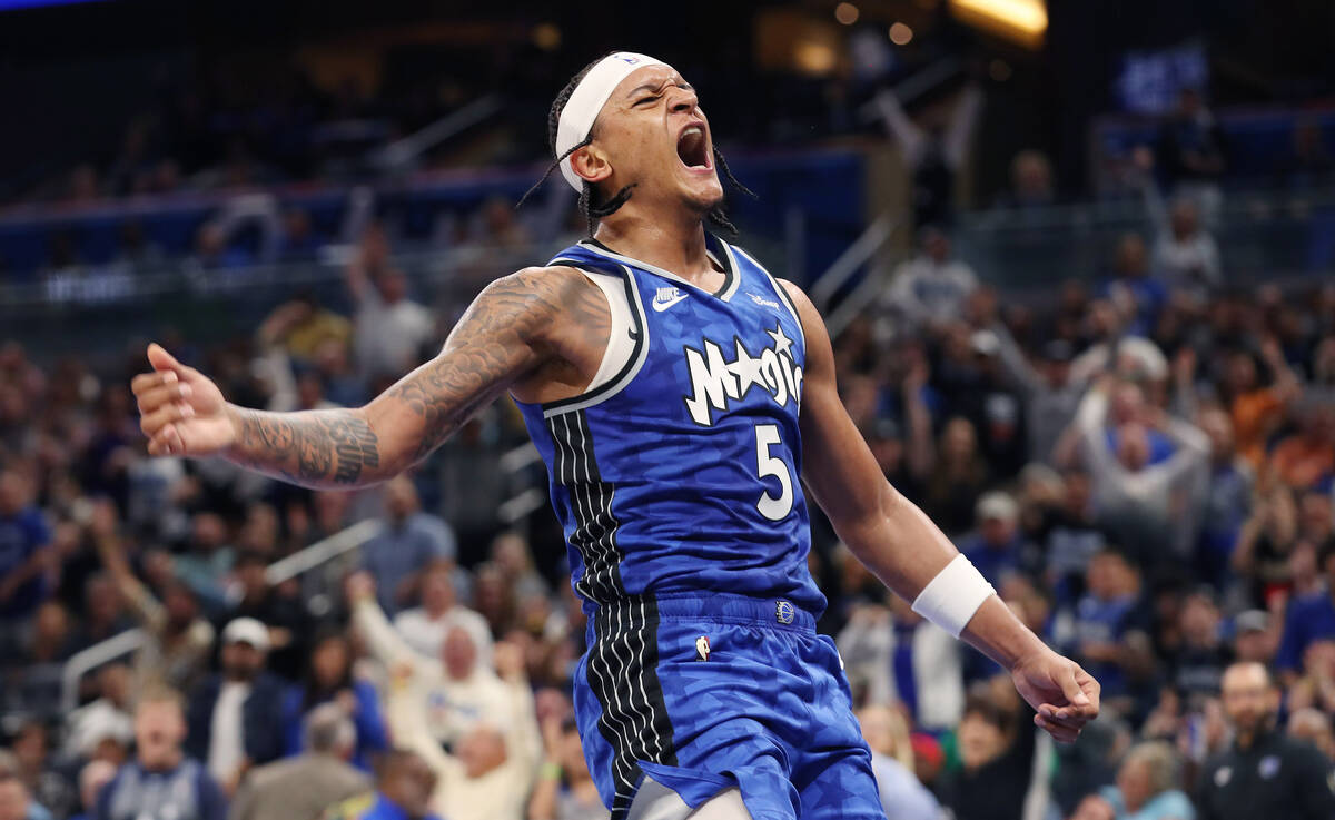 Orlando Magic forward Paolo Banchero (5) screams in celebration after a slam dunk against the L ...
