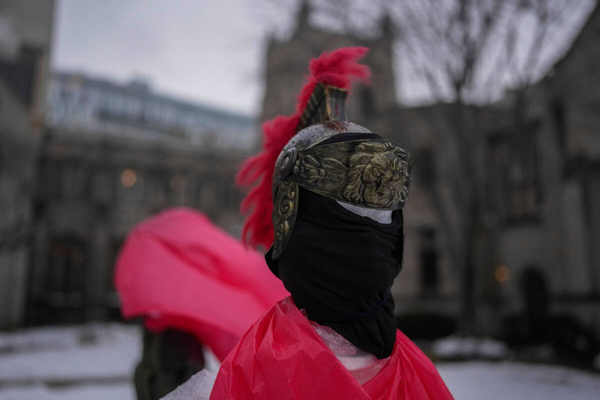 A mannequin representing a Roman solider wears a mask in the Nativity scene outside of Lake Str ...