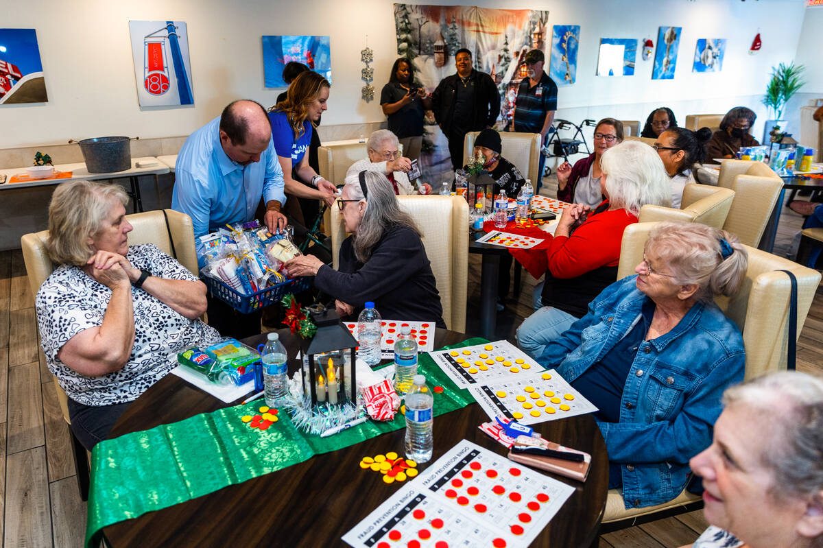 A winner selects her prize as GBank teams with the Independent Community Bankers of America in ...