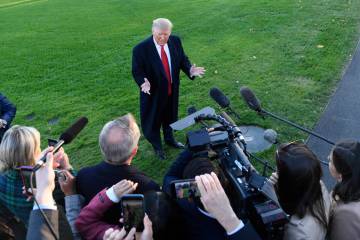 President Donald Trump talks to reporters on the South Lawn of the White House in Washington. ( ...