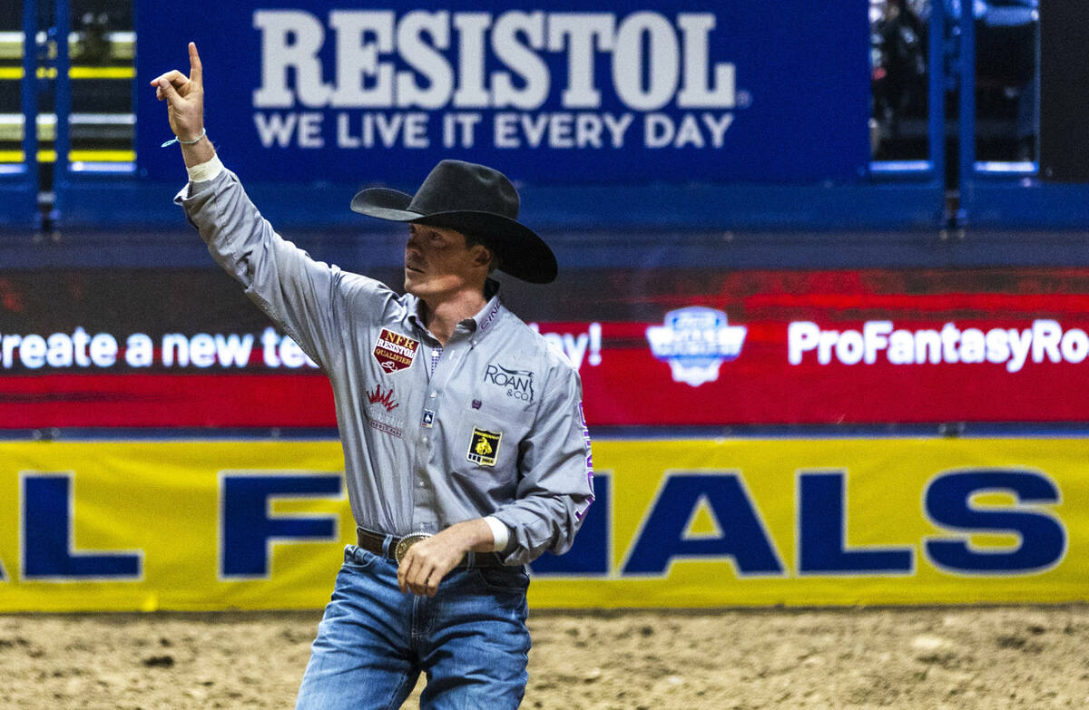 Tucker Allen celebrates a winning time in Steer Wrestling during the 9th go-round of National F ...