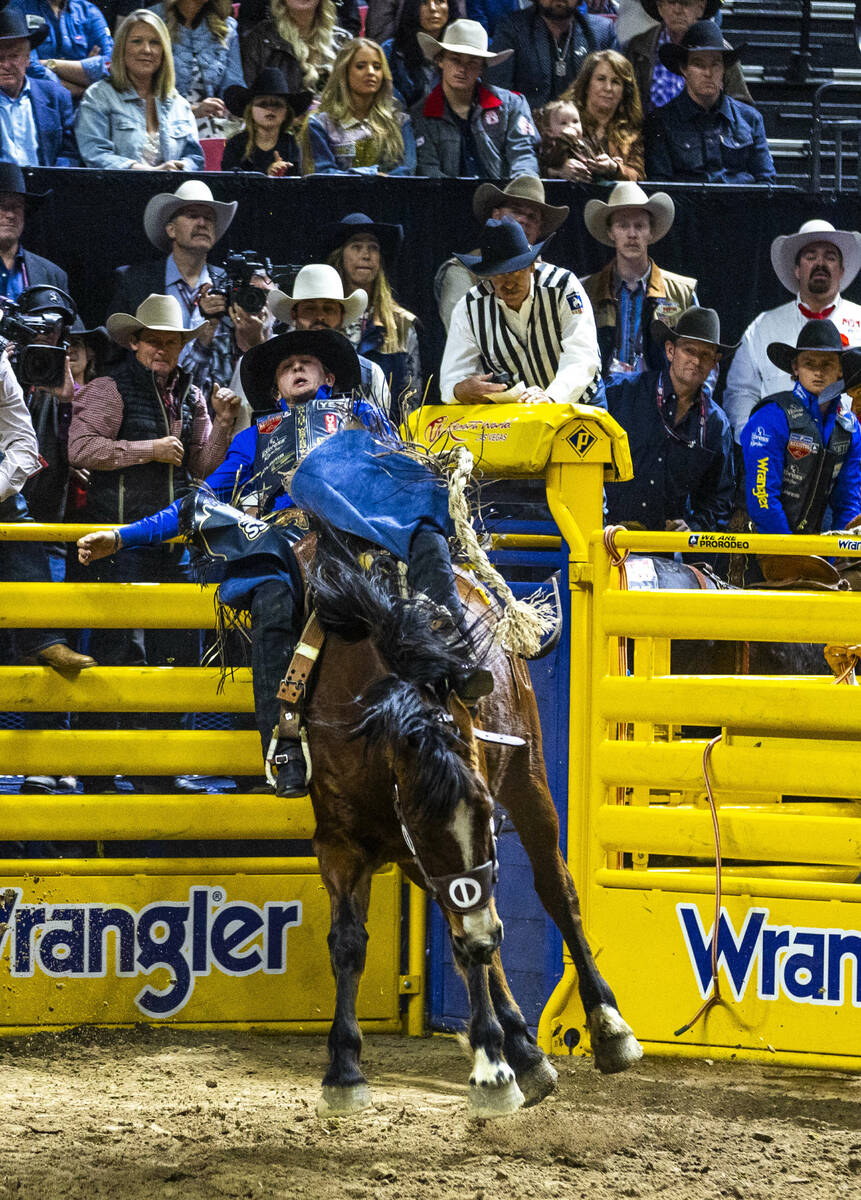 Stetson Wright rides R. Watson's Mad Skills for a winning score in Saddle Bronc Riding dur ...