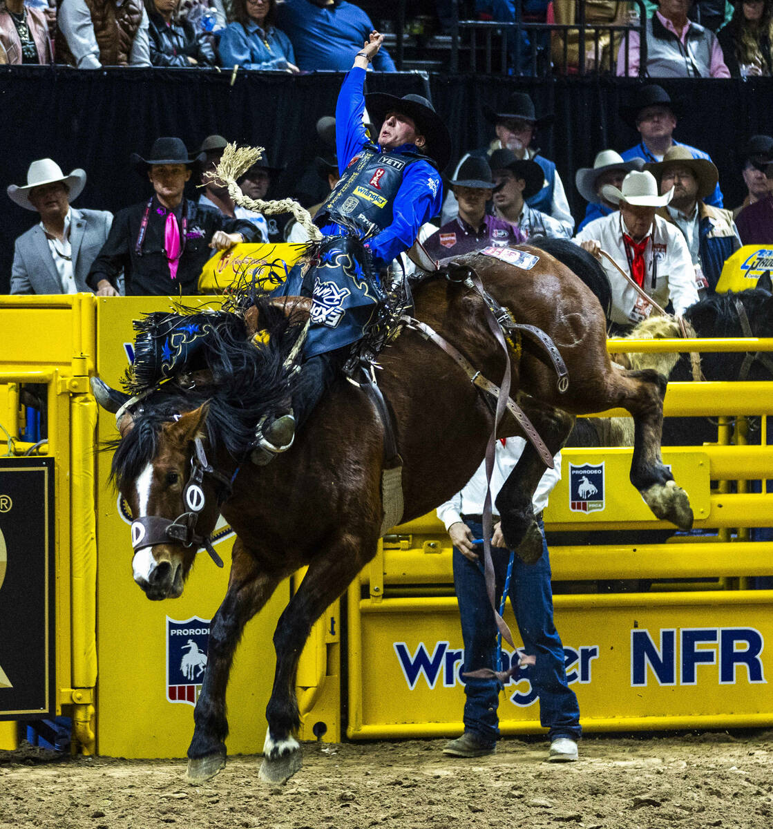 Stetson Wright rides R. Watson's Mad Skills for a winning score in Saddle Bronc Riding dur ...