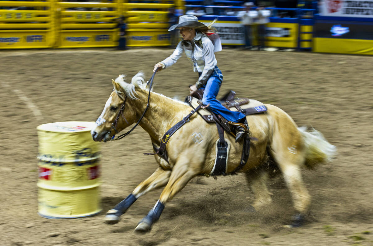 Carlee Otero navigates the second barrel seeking a winning time in Barrel Racing during the 9th ...