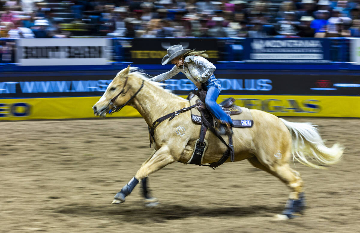 Carlee Otero sprints for home seeking a winning time in Barrel Racing during the 9th go-round o ...