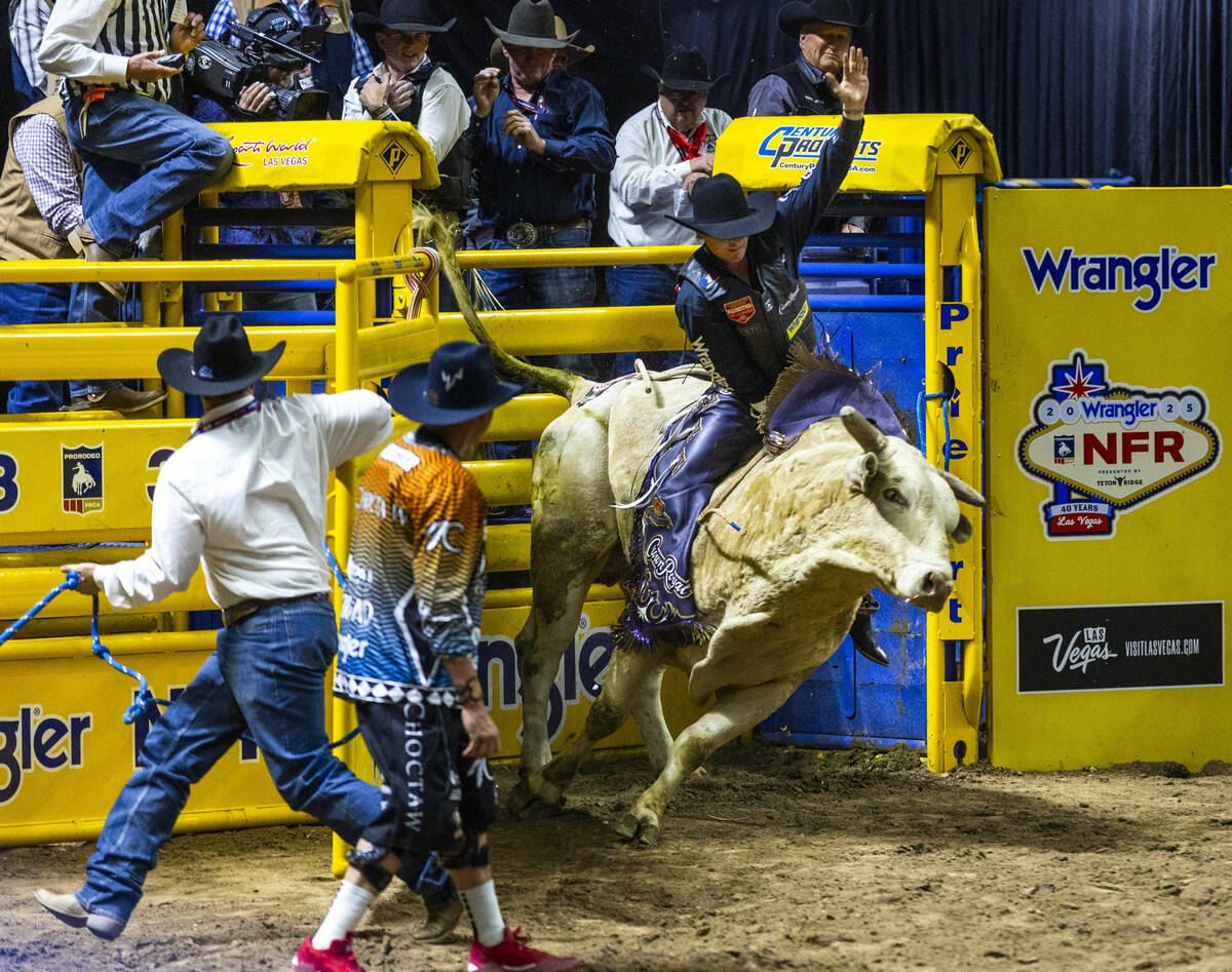 Ky Hamilton rides Cross Eyed Kelly out of the chute in Bull Riding during the 9th go-round of N ...