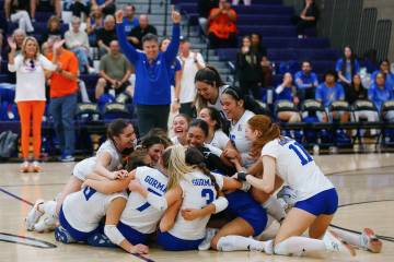 The Bishop Gorman team celebrates the Gaels’ win over Coronado in the 5A girls volleybal ...