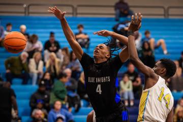 Democracy Prep wing Jaden Redding (4) reaches for the ball during a basketball game between Dem ...