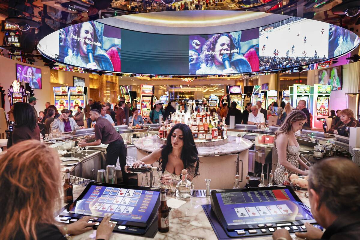 Bartenders serve drinks during the opening of the Durango hotel-casino high-limit room Monday, ...