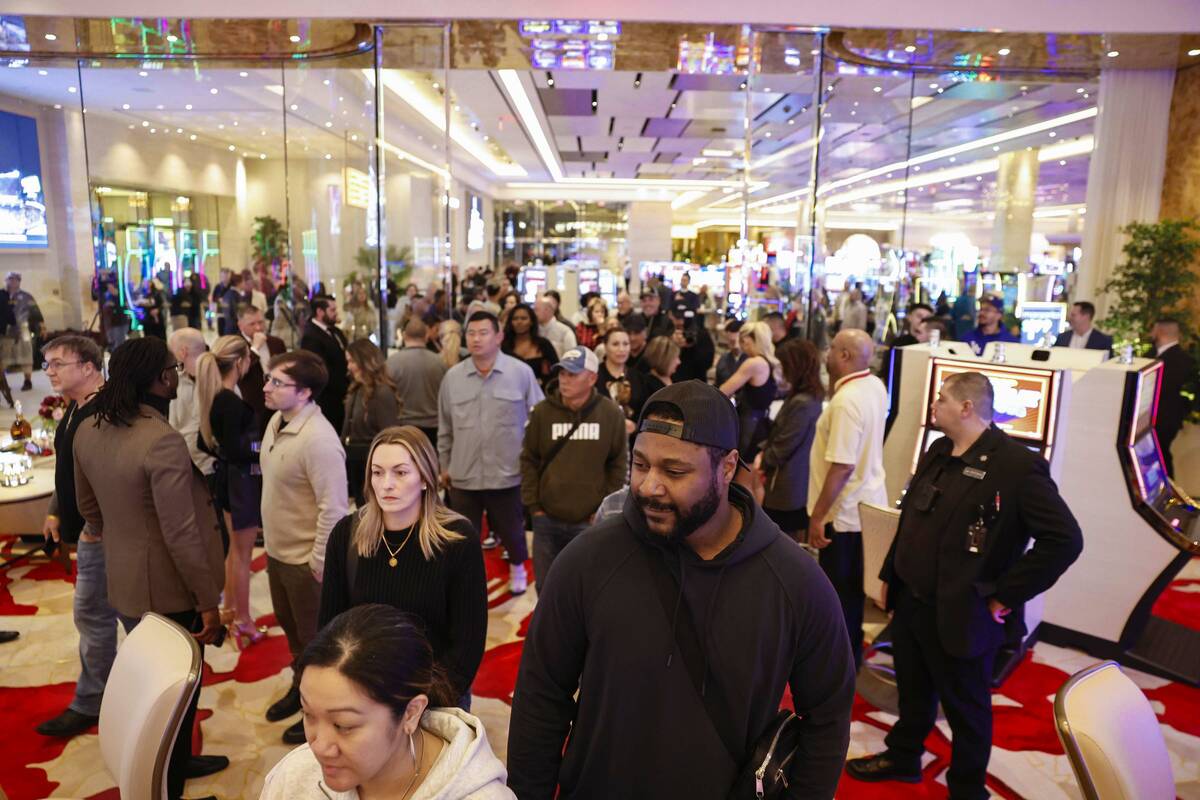 Attendees flood into the main entrance during the opening of the Durango hotel-casino high-limi ...
