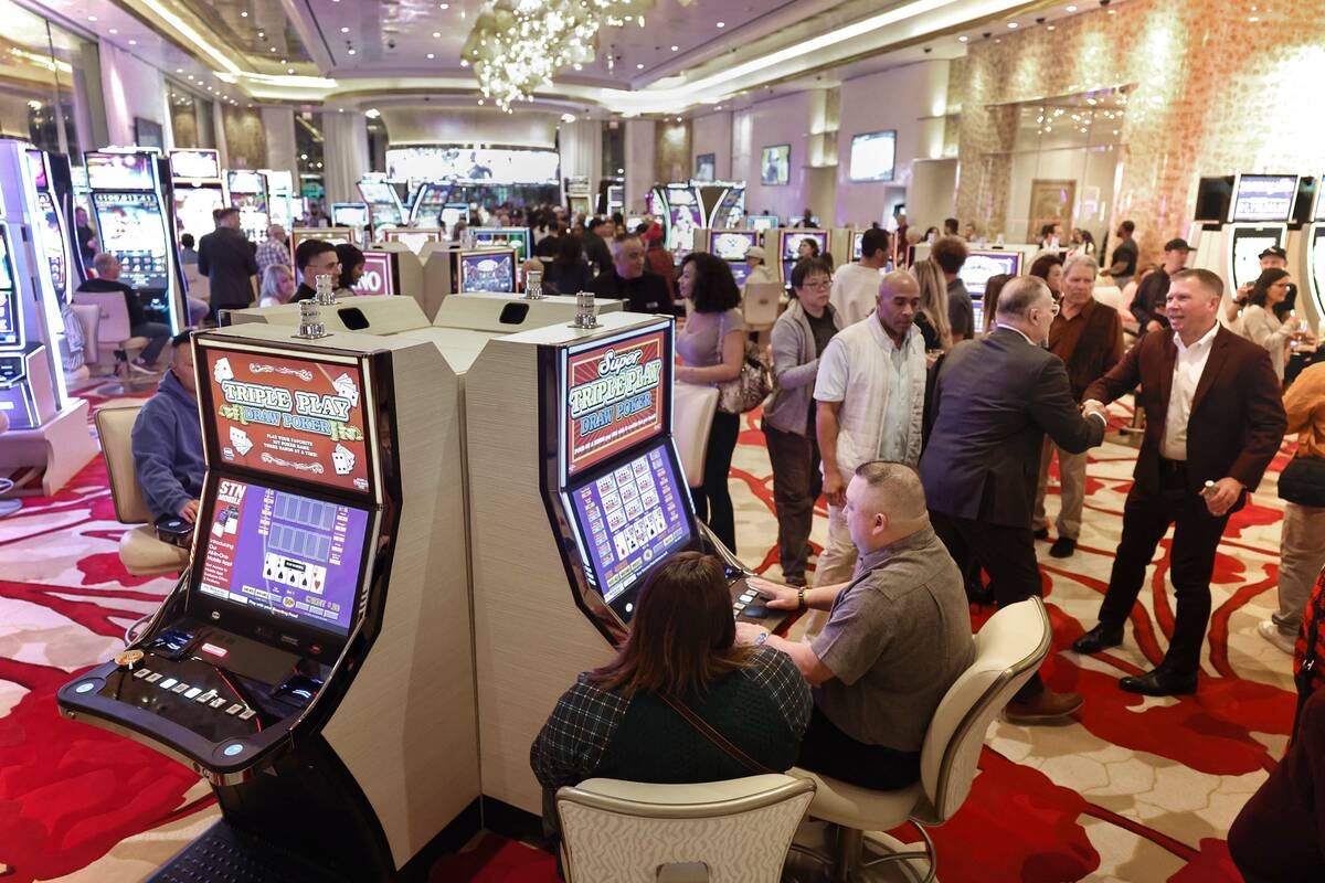 Dave Horn, right, Vice President and General Manager of Durango hotel-casino, socializes with g ...