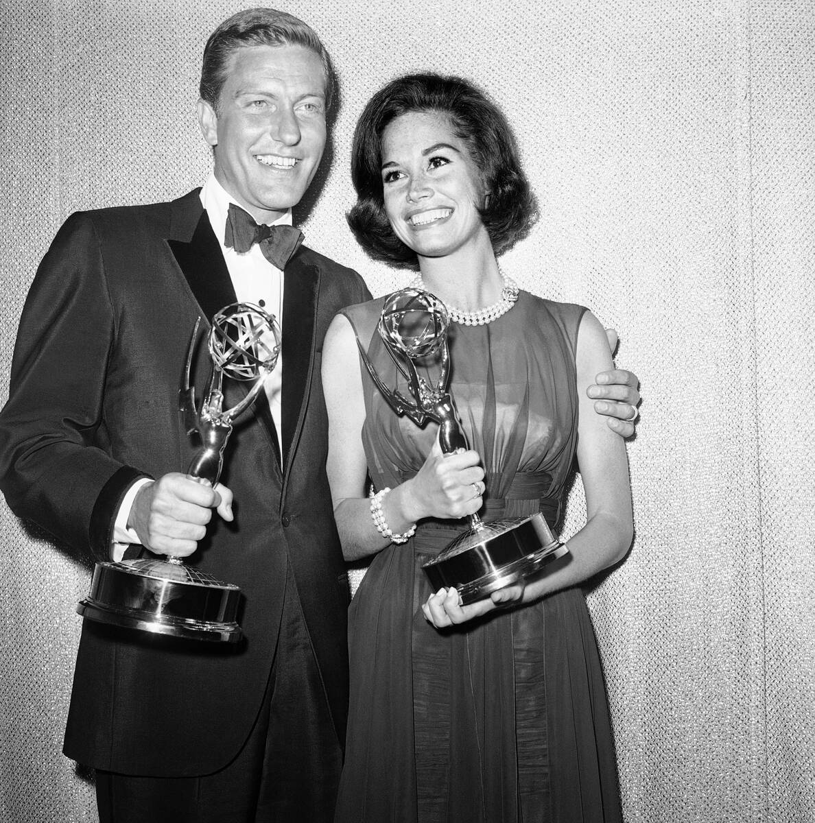 FILE - This May 25, 1964 file photo shows Dick Van Dyke, left, and Mary Tyler Moore, co-stars o ...