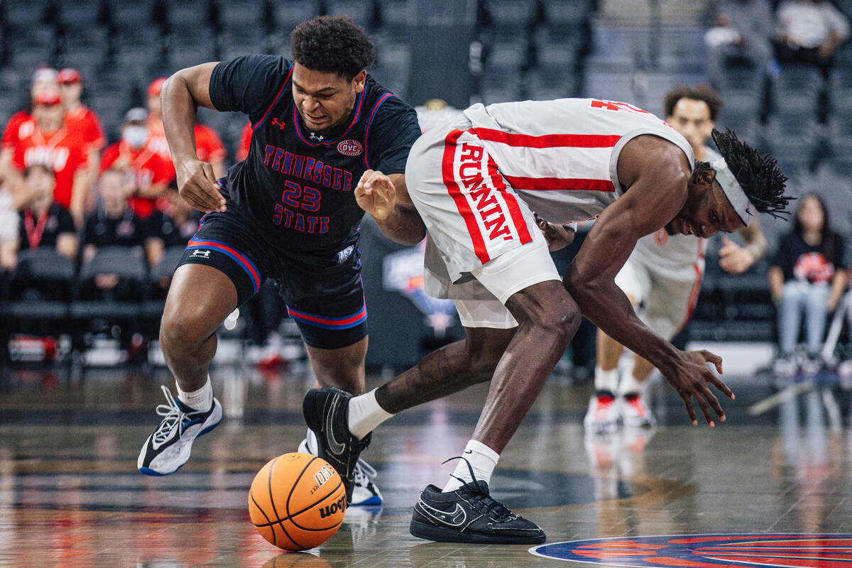 UNLV forward Emmanuel Stephen (34) and Tennessee State Tigers forward Kavien Jones (23) make a ...