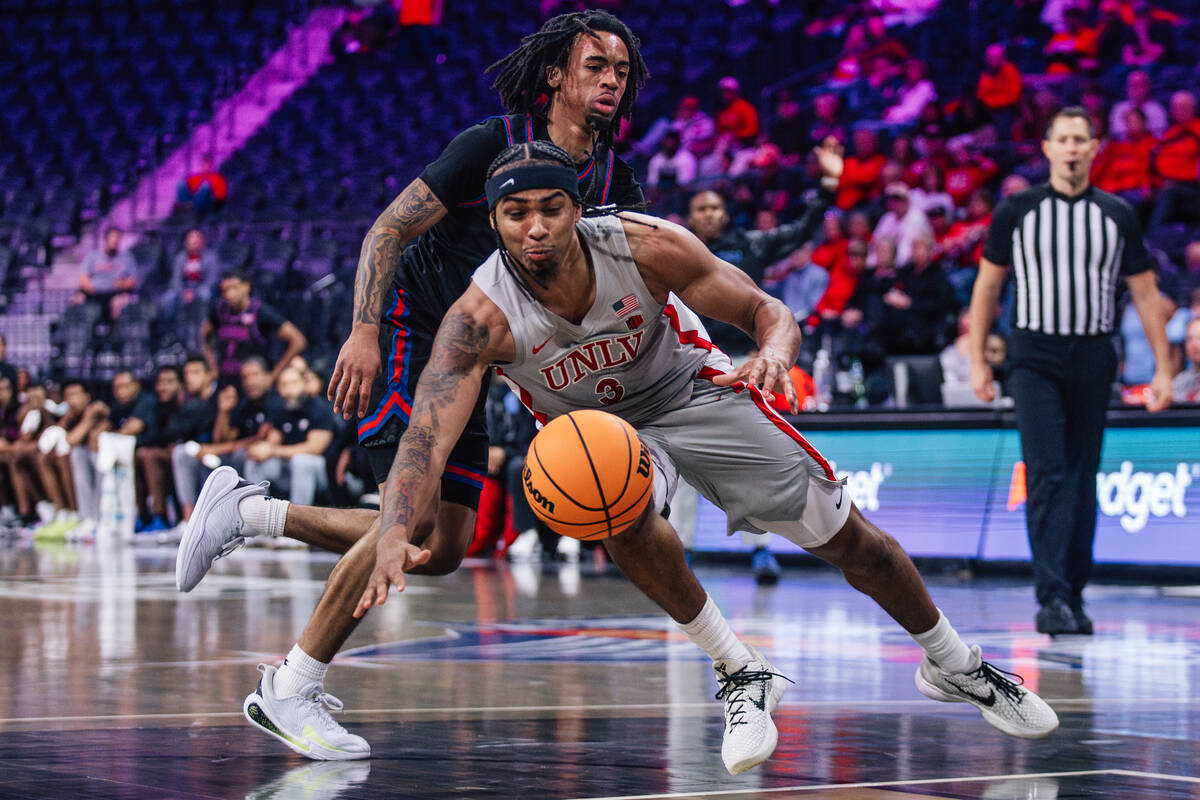 UNLV guard Howie Fleming Jr. (3) falls while dribbling the ball during a college basketball gam ...