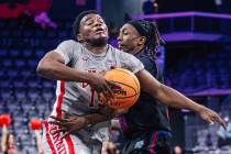 UNLV guard Issac Williamson (12) tries to move the ball during a college basketball game betwee ...