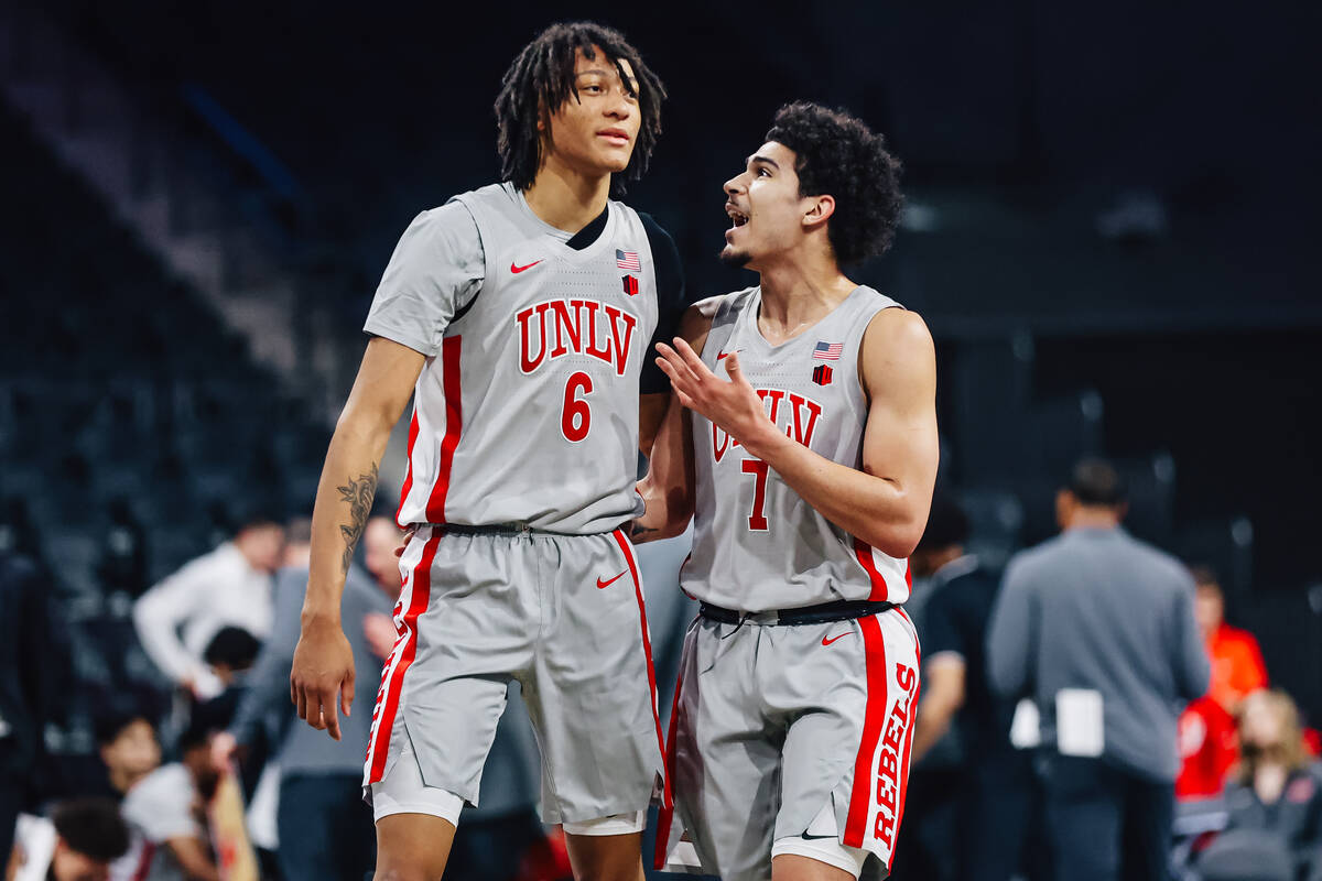 UNLV forward Tyrin Jones (6) and UNLV guard Al Green (7) walk up the court together during a co ...