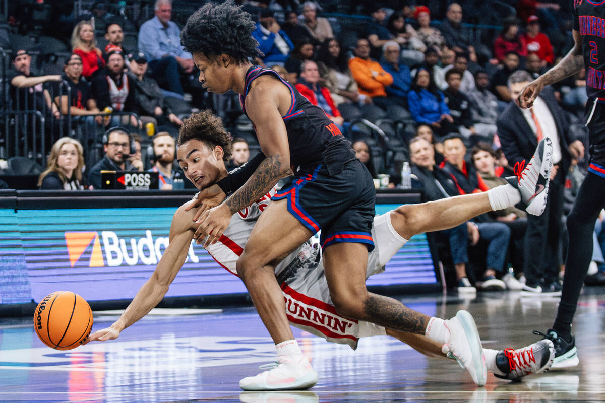 UNLV guard Dra Gibbs-Lawhorn (0) falls during. A chase for the ball during a college basketball ...