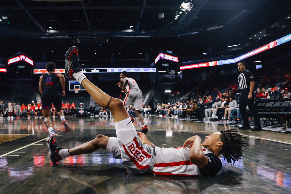 UNLV forward Tyrin Jones (6) falls during a college basketball game between UNLV and Tennessee ...