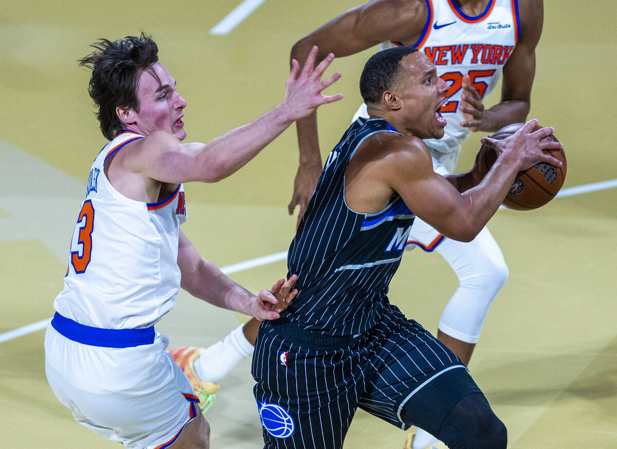 New York Knicks guard Tyler Kolek (13) is unable to stop Orlando Magic center Wendell Carter Jr ...