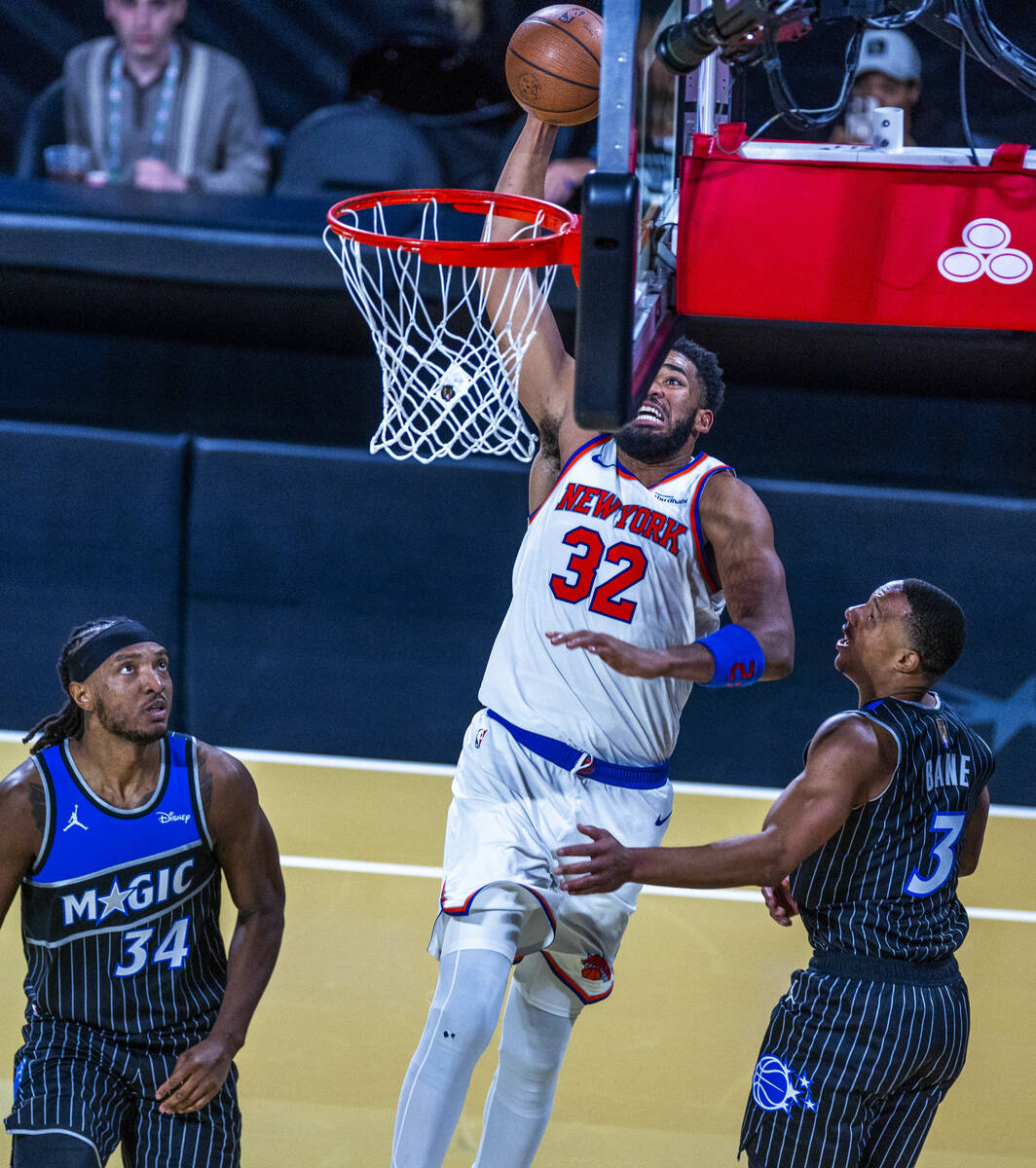 New York Knicks center Karl-Anthony Towns (32) dunks the ball against Orlando Magic center Wend ...