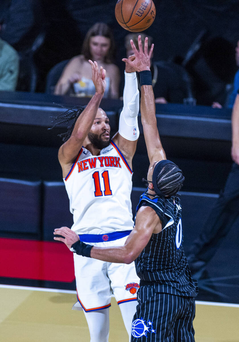 New York Knicks guard Jalen Brunson (11) shoots the ball over Orlando Magic guard Anthony Black ...
