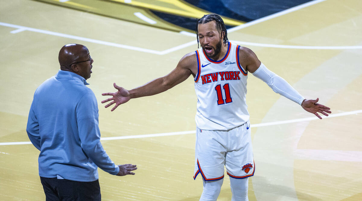 New York Knicks guard Jalen Brunson (11) has a conversation with head coach Mike Brown against ...
