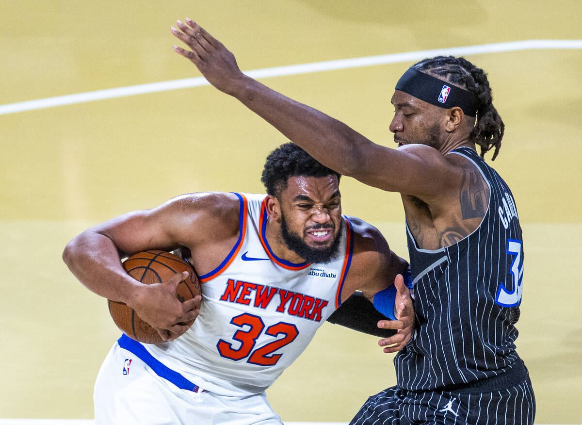 New York Knicks center Karl-Anthony Towns (32) battles for position under the basket against Or ...