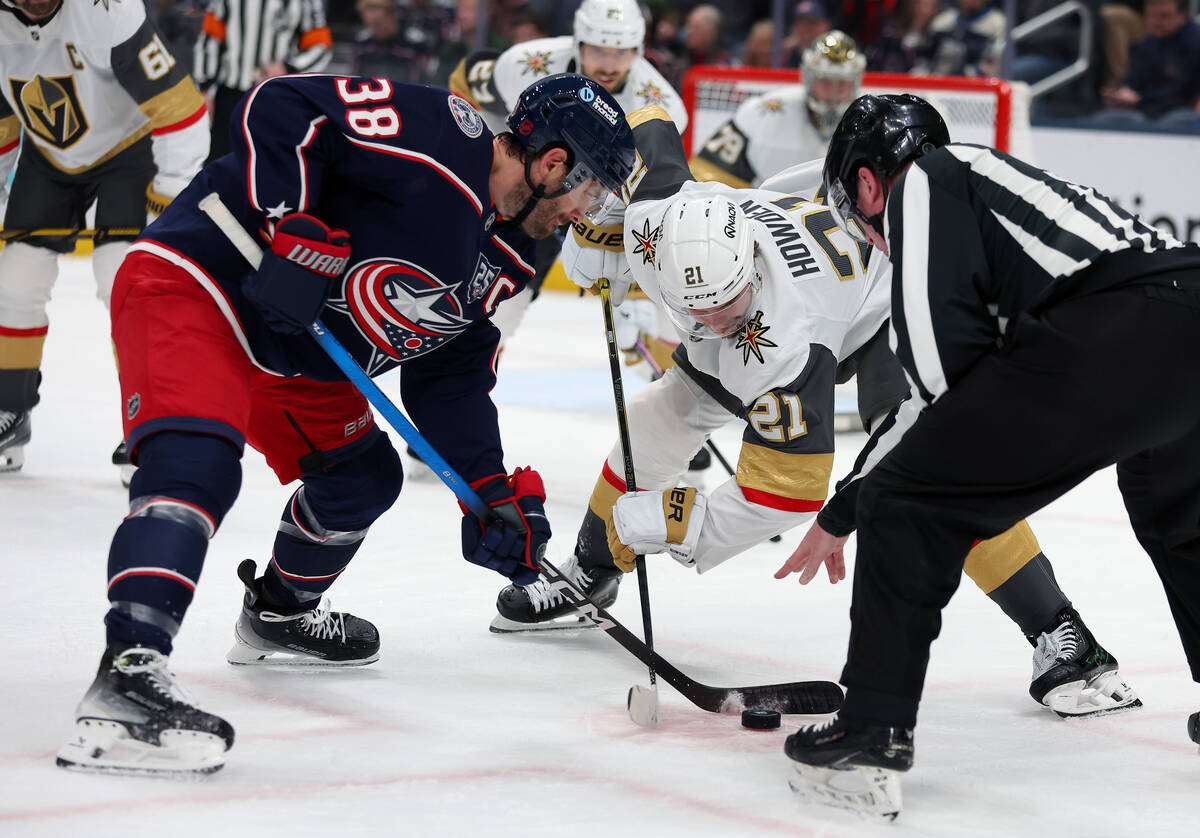 Columbus Blue Jackets center Boone Jenner (38) and Vegas Golden Knights center Brett Howden (21 ...