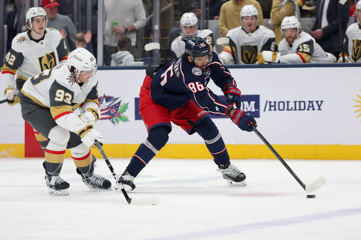 Columbus Blue Jackets right wing Kirill Marchenko (86) controls the puck as Vegas Golden Knight ...
