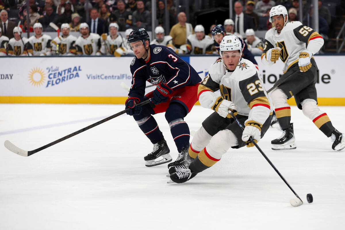 Vegas Golden Knights left wing Cole Reinhardt (23) controls the puck as Columbus Blue Jackets c ...