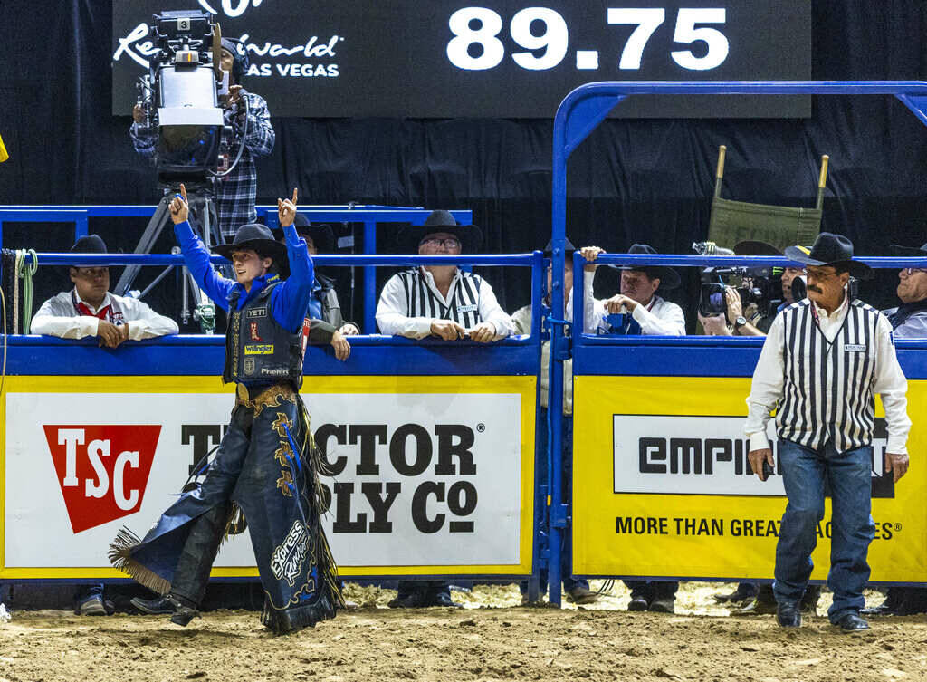 Stetson Wright celebrates his winning ride on R. Watson's Mad Skills in Saddle Bronc Ridin ...