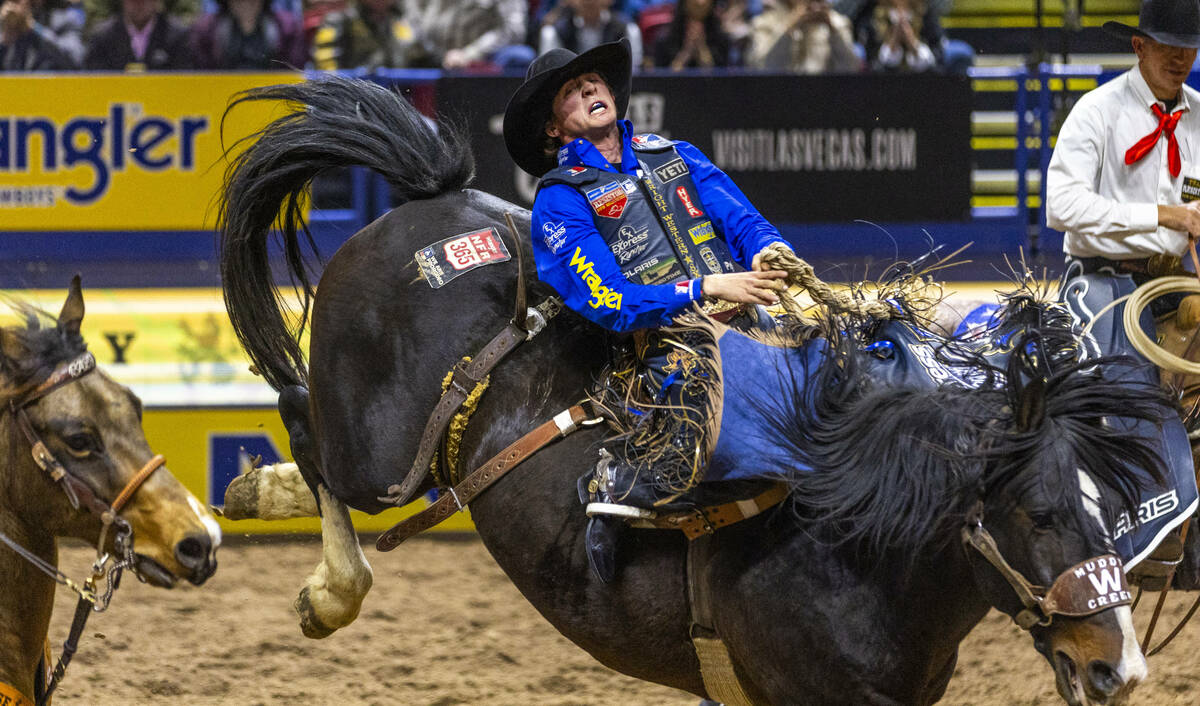 Stetson Wright rides Bugsy in Saddle Bronc Riding during Day 2 of National Finals Rodeo at the ...