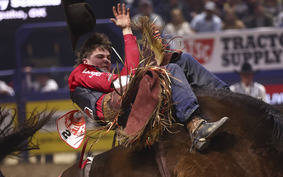 Wacey Schalla rides Big Dance while competing in bareback riding during the eighth go-round of ...