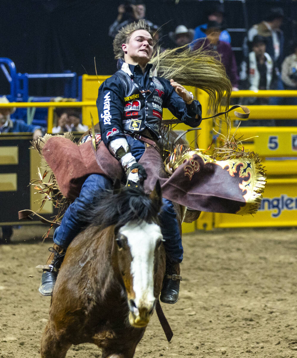 Wacey Schalla rides Lost Lakota in Bareback Riding during the 9th go-round of National Finals R ...