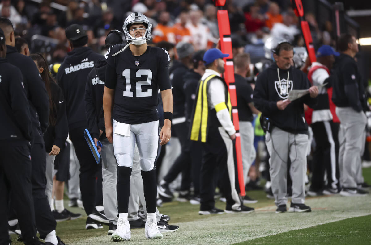 Raiders quarterback Aidan O'Connell (12) looks on during the second half of an NFL game ag ...