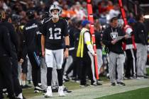 Raiders quarterback Aidan O'Connell (12) looks on during the second half of an NFL game ag ...