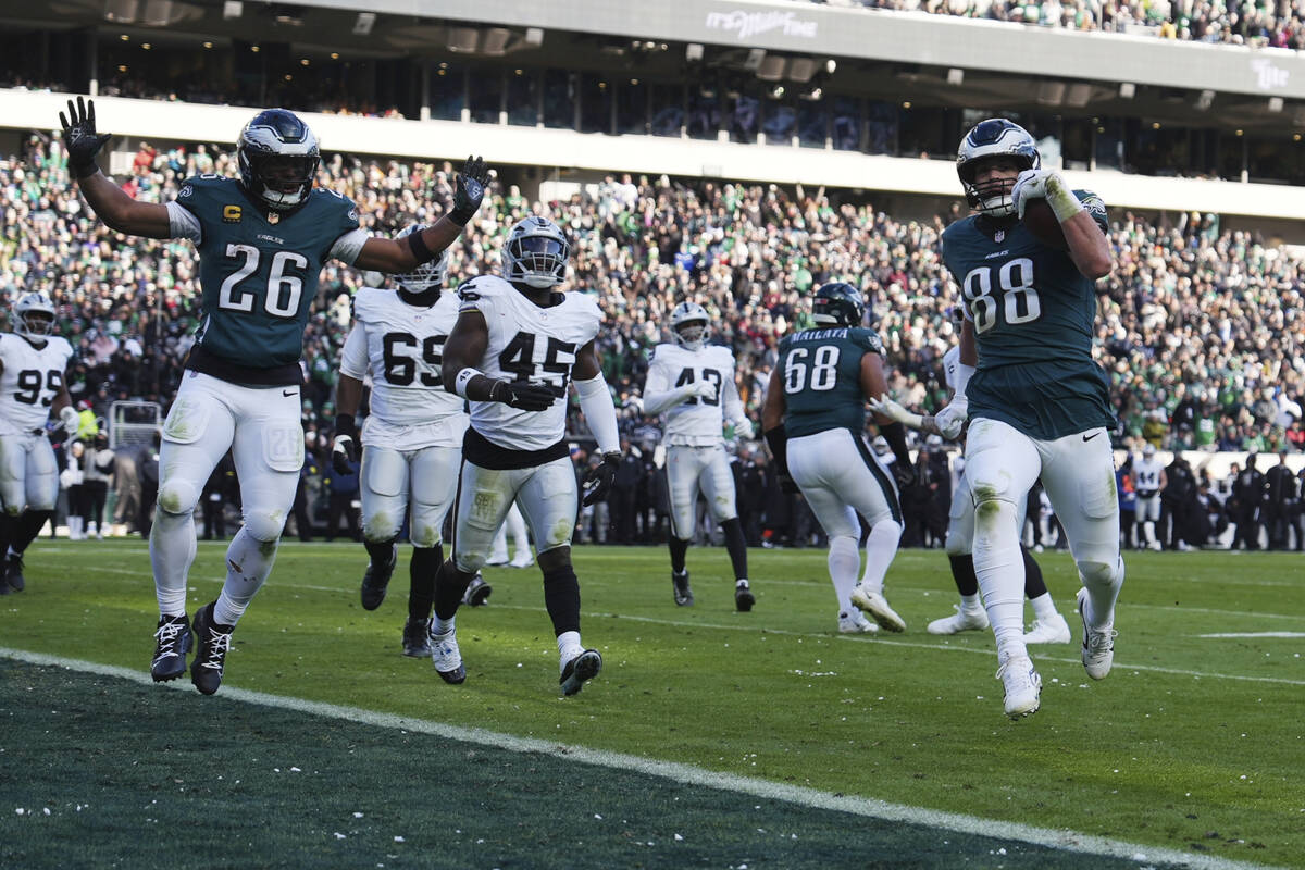 Philadelphia Eagles tight end Dallas Goedert (88) runs for a touchdown as Eagles running back S ...
