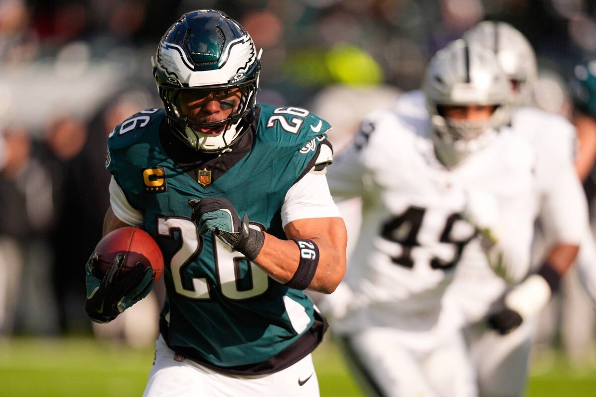 Philadelphia Eagles running back Saquon Barkley (26) runs with the ball during the first half o ...