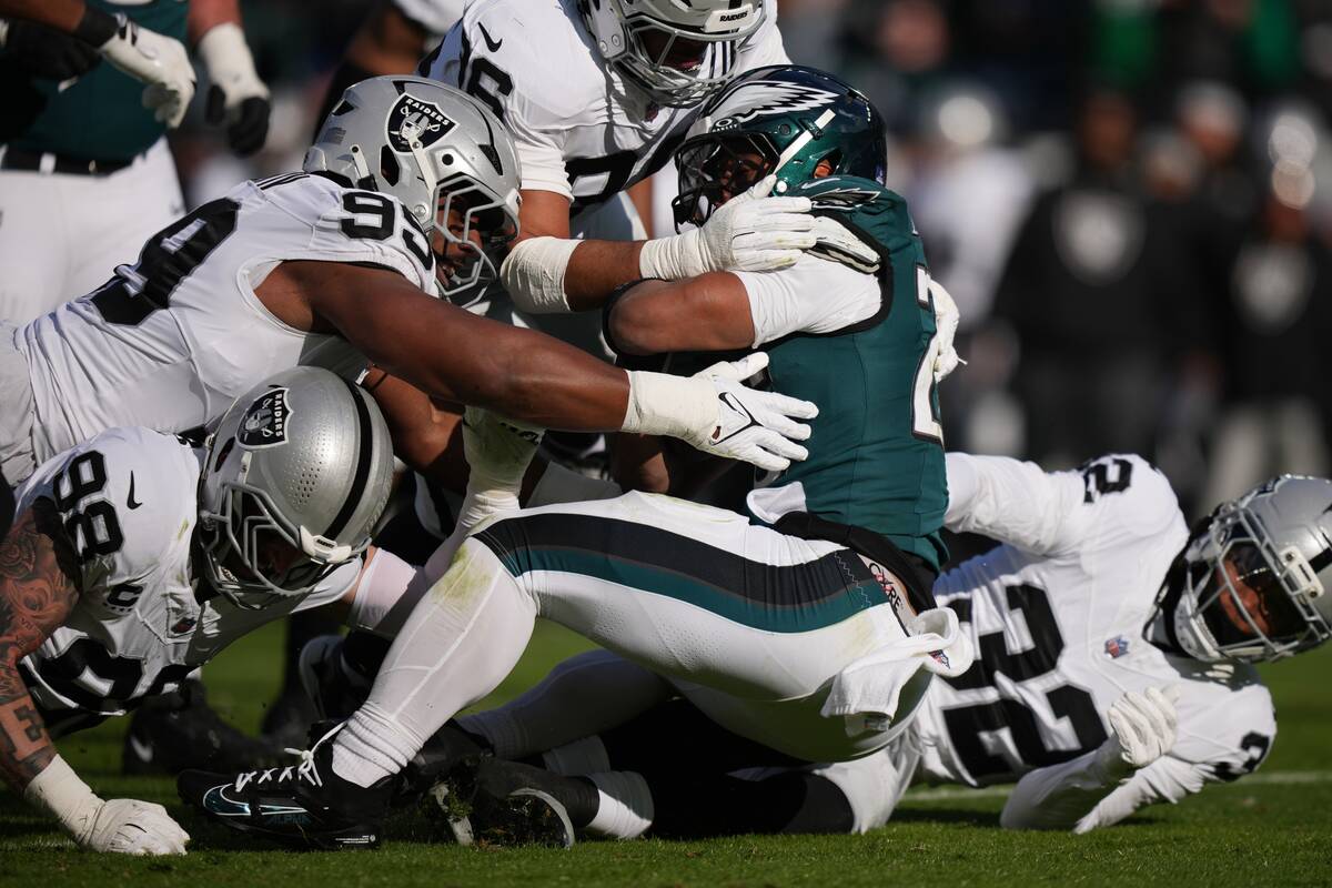 Philadelphia Eagles running back Saquon Barkley (26) tackled after a run during the first half ...