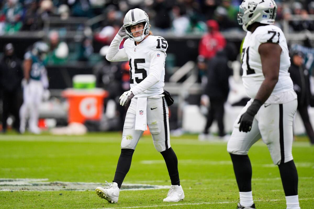 Las Vegas Raiders quarterback Kenny Pickett (15) reacts to an incomplete pass during the first ...