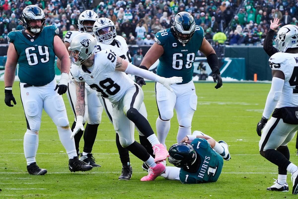 Las Vegas Raiders defensive end Maxx Crosby (98) celebrates after sacking Philadelphia Eagles q ...