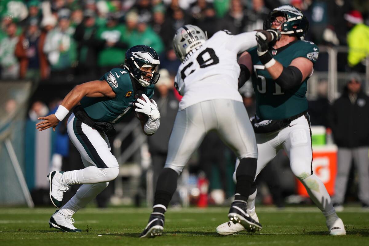 Philadelphia Eagles quarterback Jalen Hurts (1) runs with the ball during the first half of an ...