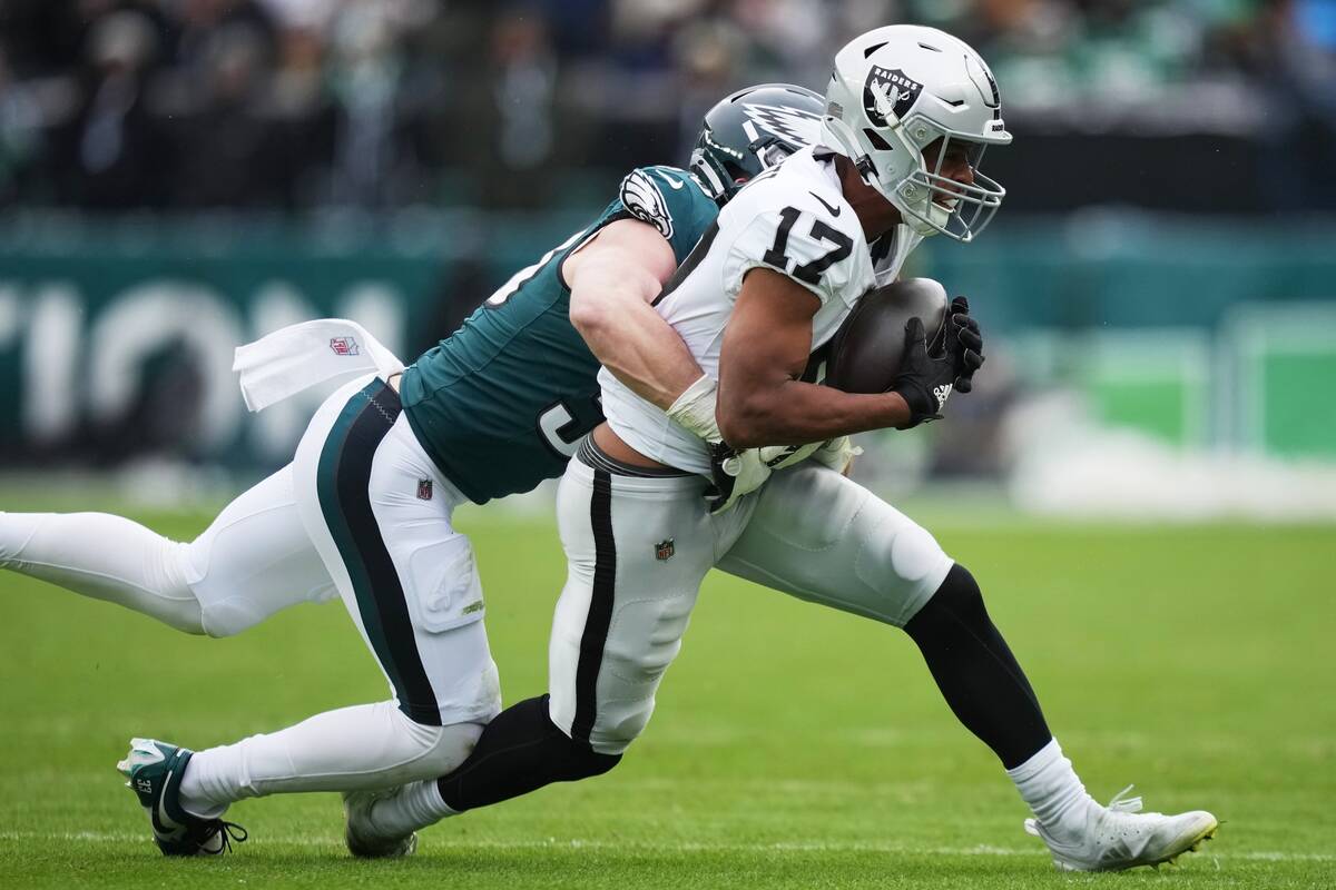 Las Vegas Raiders wide receiver Tyler Lockett (17) is tackled by Philadelphia Eagles cornerback ...