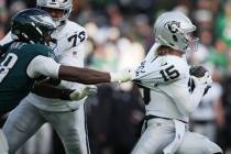 Philadelphia Eagles linebacker Jalyx Hunt (58) grabs Las Vegas Raiders quarterback Kenny Picket ...