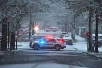 Police vehicles rest in intersections in a neighborhood near Brown University, Sunday, Dec. 14, ...