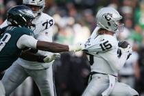 Philadelphia Eagles linebacker Jalyx Hunt (58) grabs Las Vegas Raiders quarterback Kenny Picket ...