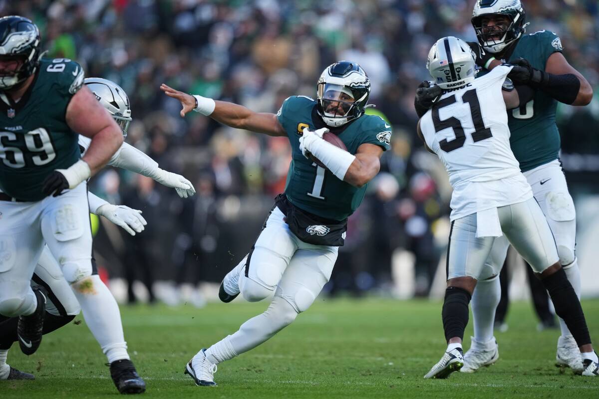 Philadelphia Eagles quarterback Jalen Hurts (1) runs with the ball during the second half of an ...