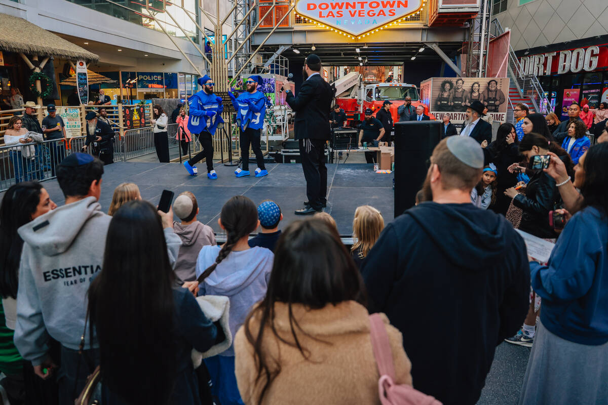 The Dancing Dreidels dance during the Fremont Street Experience menorah lighting Sunday, Dec. 1 ...